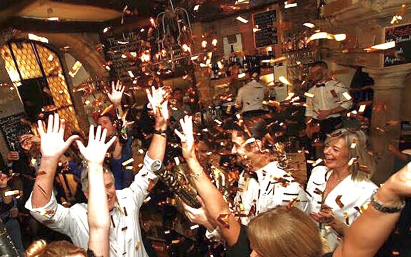 Confetti and raised hands at a private party at Dipso
